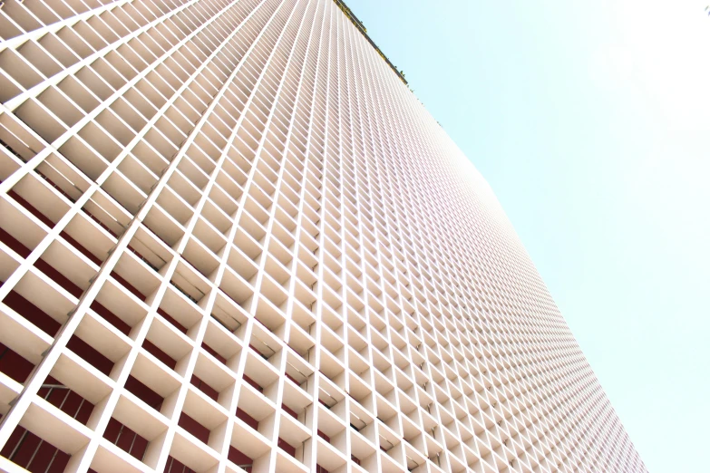 a tall white building with a blue sky in the background, inspired by David Chipperfield, pexels contest winner, brutalism, red grid, judy chicago, extremely hyperdetailed, in hong kong