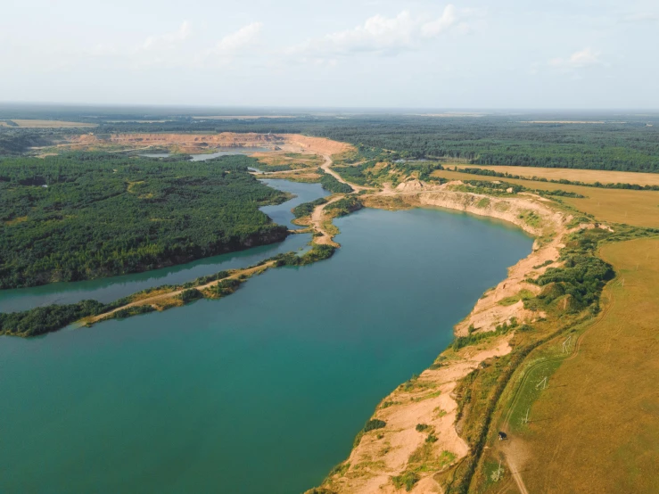 an aerial view of a large body of water, by Adam Marczyński, pexels contest winner, hurufiyya, mining outpost, zdzislaw beksinsk, thumbnail, listing image