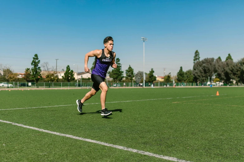 a man running across a grass covered field, athletic crossfit build, thin straight purple lines, lachlan bailey, profile image