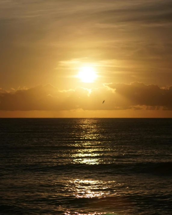 the sun is setting on the horizon of the ocean, inspired by Edwin Deakin, pexels contest winner, romanticism, golden linings, today\'s featured photograph 4k, shot on 1 5 0 mm, fading rainbow light