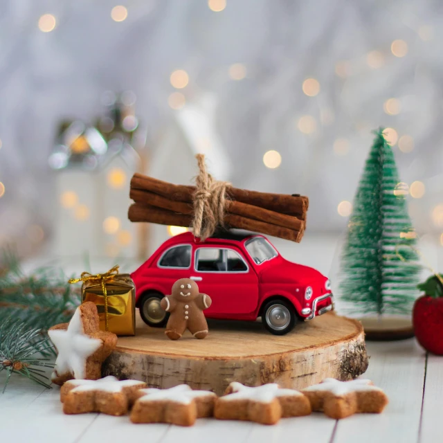 a red car with a christmas tree on top of it, by Julia Pishtar, pexels contest winner, photorealism, wooden art toys on base, cinnamon, food, stylised