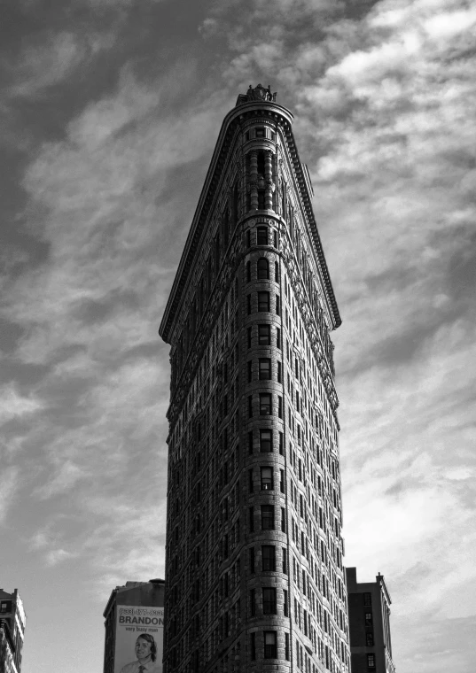 a black and white photo of a tall building, inspired by Yousuf Karsh, unsplash contest winner, art nouveau, square, louis sullivan, standing tall, color splash