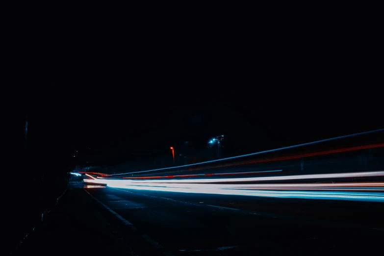a blurry photo of a street at night, a picture, unsplash contest winner, speed lines, red and blue black light, amoled wallpaper, vehicle