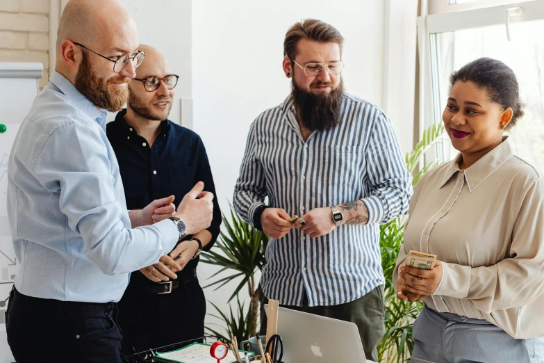 a group of people standing around a table with a laptop, pexels contest winner, arbeitsrat für kunst, wearing business casual dress, profile image, maintenance photo, thumbnail