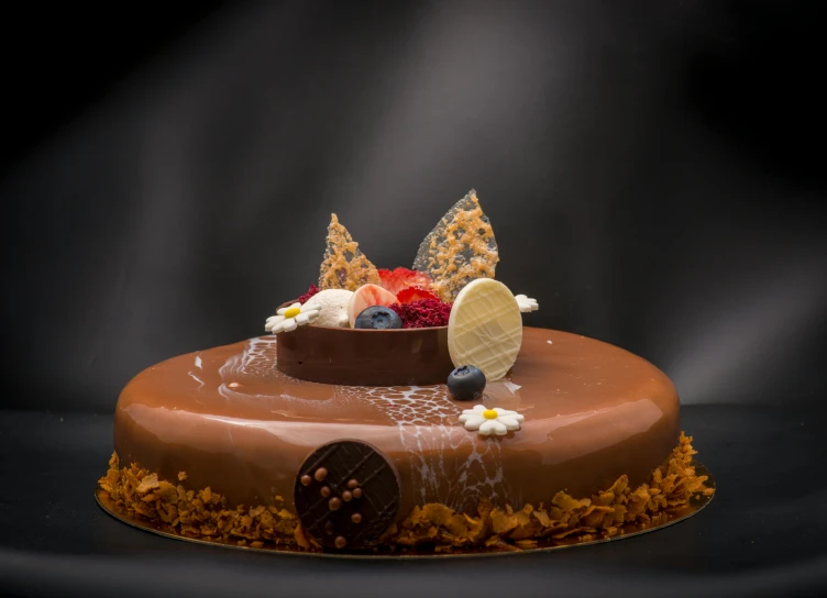 a chocolate cake sitting on top of a table, boucheron, floating crown, food photography 4 k, fan favorite