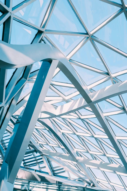 a large metal structure with a blue sky in the background, inspired by Zaha Hadid, unsplash contest winner, light and space, bright lit interiors, square facial structure, “diamonds, branching hallways