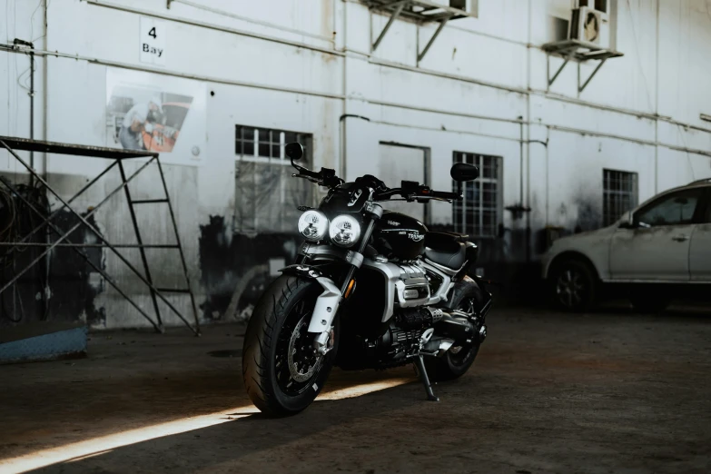 a motorcycle parked in front of a building, inspired by Hendrick Cornelisz Vroom, pexels contest winner, dark hangar background, manuka, pepper, profile image