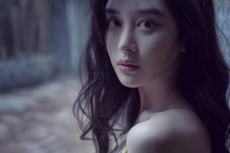 a woman in a yellow dress posing for a picture, inspired by Tang Yifen, pexels contest winner, photorealism, soft light.4k, iu, porcelain skin ”, young woman with long dark hair