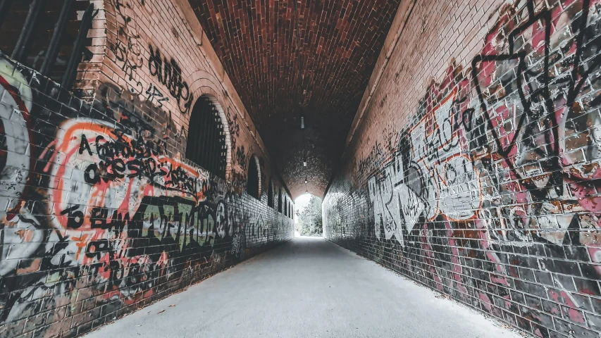 a tunnel that has graffiti all over it, pexels contest winner, bricks, background image, empty streetscapes, instagram photo