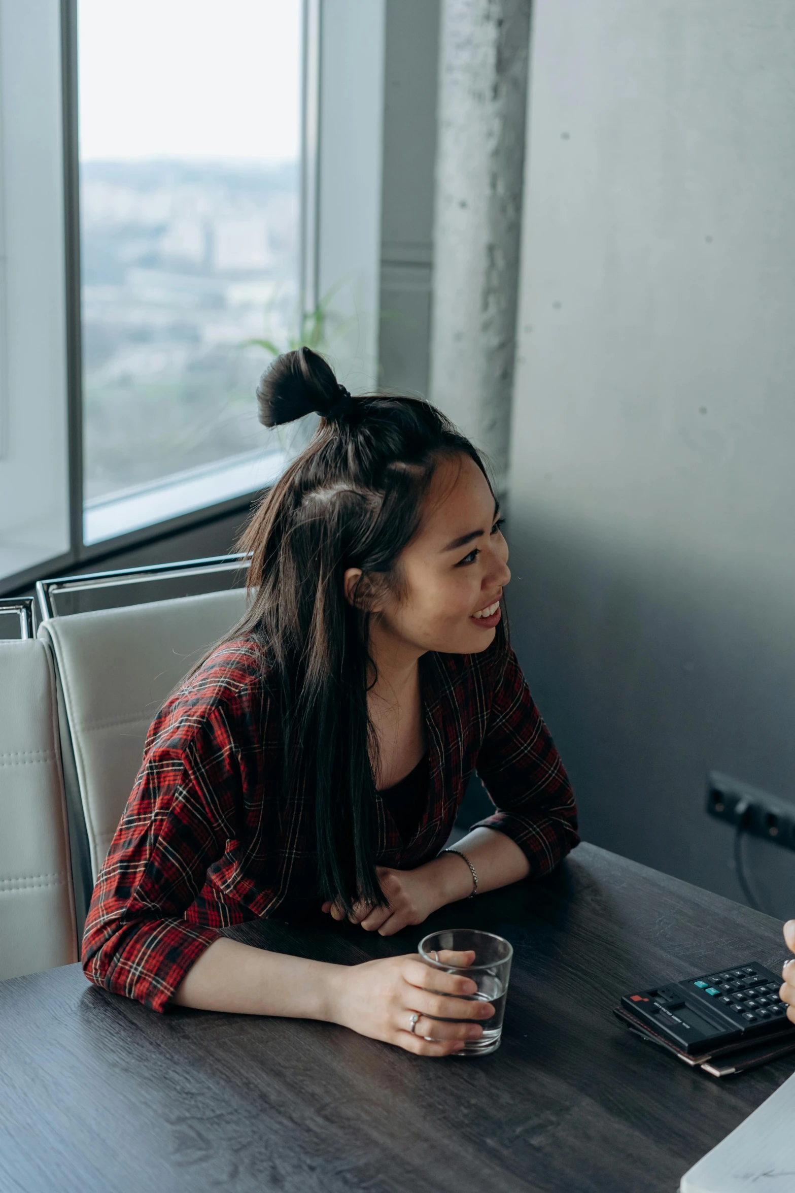 two women sitting at a table talking to each other, trending on unsplash, asian girl with long hair, creative coder with a computer, looking out window, full frame image