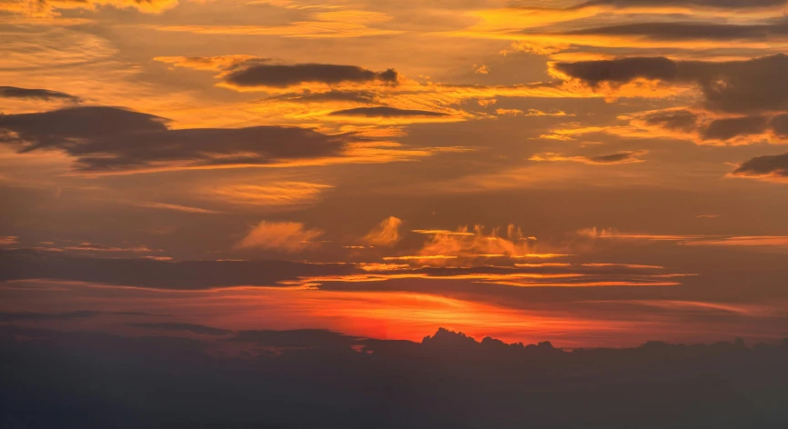 a large body of water under a cloudy sky, a picture, pexels contest winner, romanticism, orange and red sky, ((sunset)), high resolution, skyscape