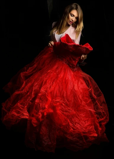 a woman in a red dress in the dark, an album cover, by irakli nadar, shutterstock contest winner, renaissance, ! haute couture!, high resolution print :1 red, flowy, exciting