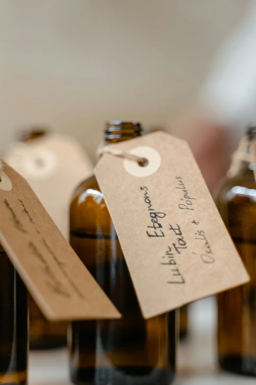 a group of brown bottles sitting on top of a table, by Aileen Eagleton, unsplash, medical labels, organic ornaments, bath, thumbnail