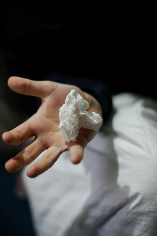 a close up of a person holding something in their hand, by artist, plasticien, made of lab tissue, ignant, marshmallow, ultra crisp
