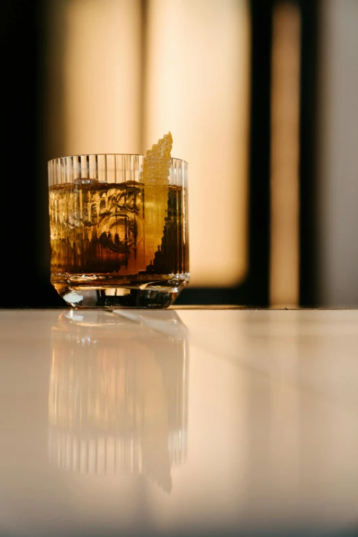 a glass of whiskey sitting on top of a counter, a portrait, unsplash, renaissance, medium format. soft light, profile image, mies van der rohe, drinking cocktail