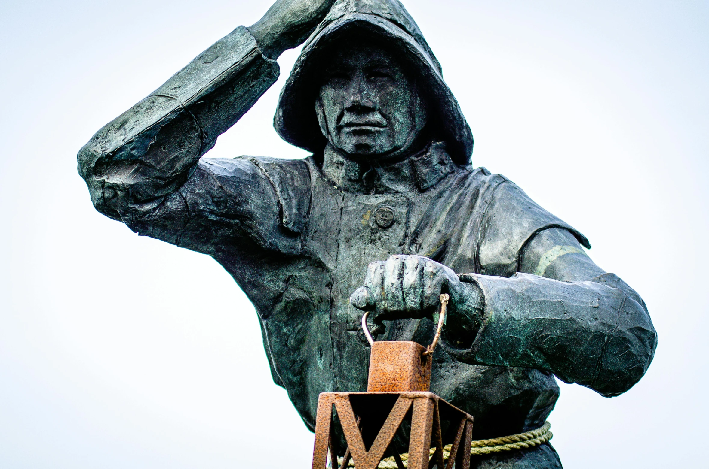 a statue of a man holding a lantern, inspired by Mór Than, catapult, closeup photograph, 🚿🗝📝