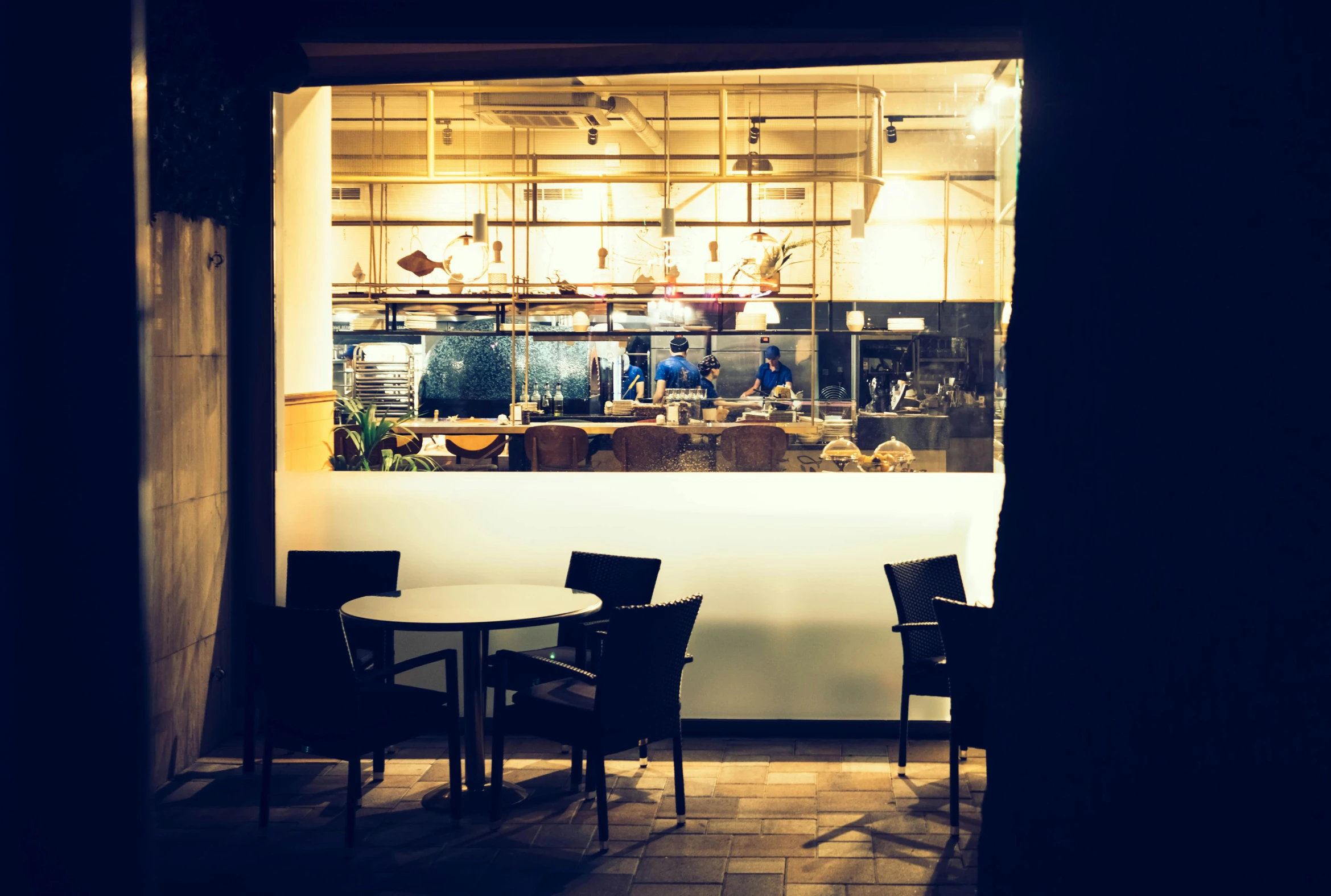 a view of a restaurant through a window, unsplash, ambient lighting at night, chef table, patio, profile image