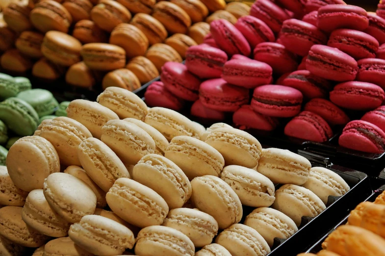 a display case filled with lots of different types of macarons, by Tom Wänerstrand, pexels, visual art, 🦩🪐🐞👩🏻🦳, food photography 4 k, cream, panels