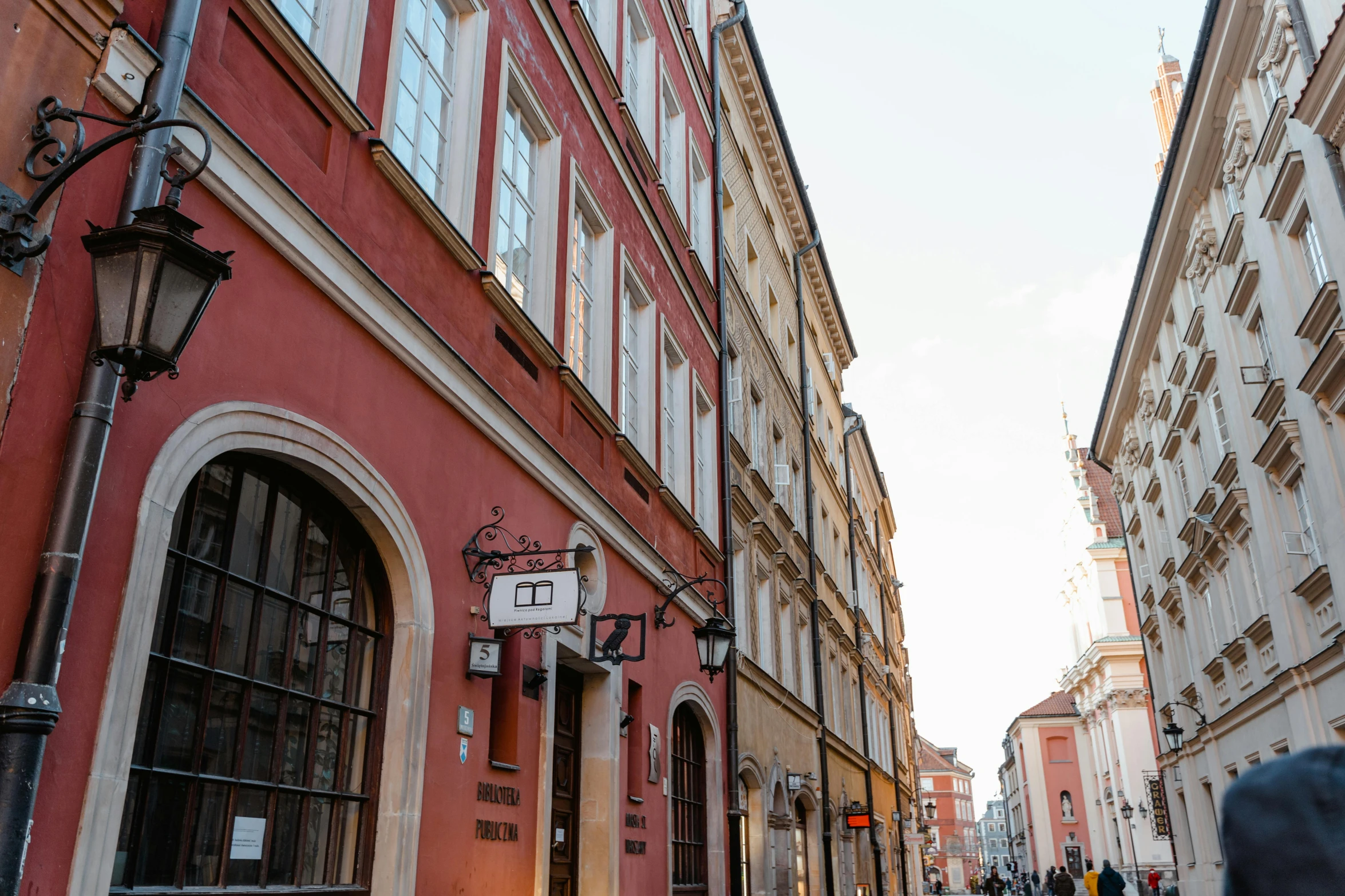 a group of people walking down a street next to tall buildings, pexels contest winner, danube school, red building, preserved historical, profile image, square