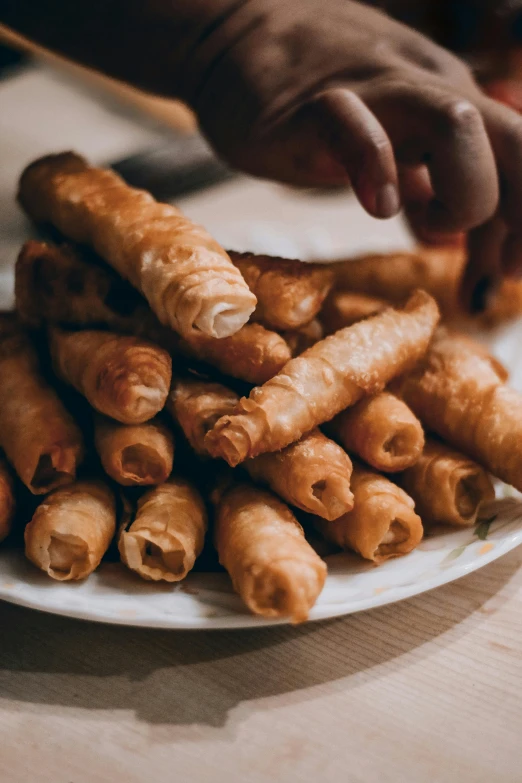 a close up of a plate of food on a table, joints, thumbnail, nuttavut baiphowongse, pastries