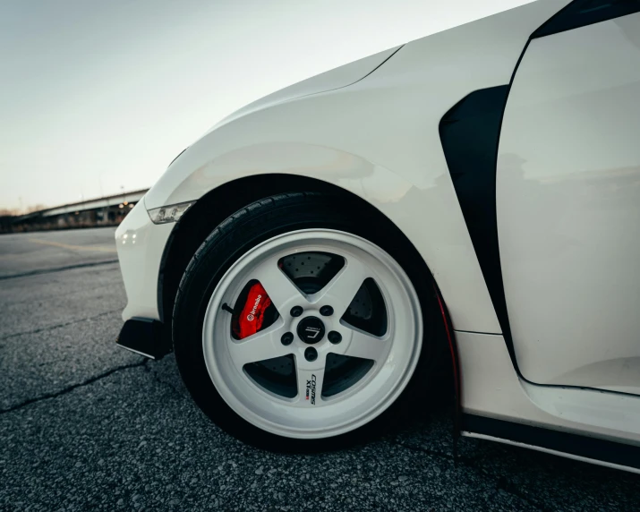 a white car parked on the side of the road, pexels contest winner, white wheel rims, silver white red details, race style, honda civic