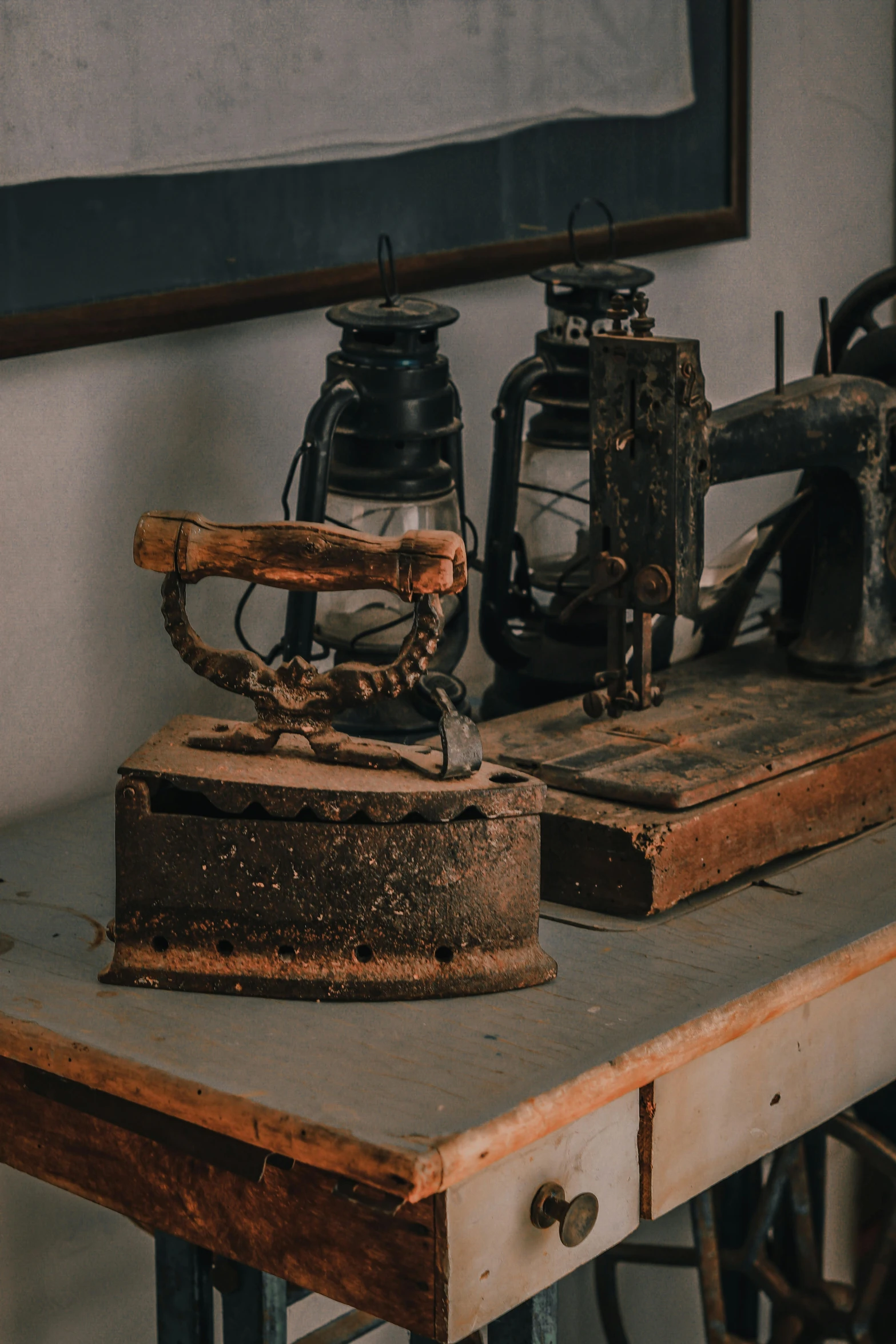 an old sewing machine sitting on top of a wooden table, vessels, ((rust)), unsplash photo contest winner, preserved museum piece