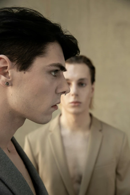 a couple of men standing next to each other, by Caro Niederer, trending on pexels, bauhaus, 1 7 - year - old boy thin face, color photograph portrait 4k, drama, lgbtq