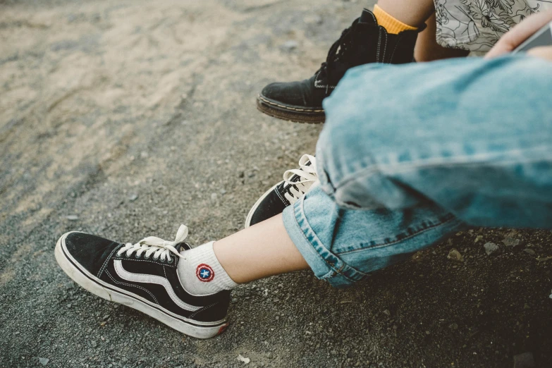 a couple of people that are sitting on a bench, trending on pexels, sneaker shoes, laying on the ground, childhood friend, denim