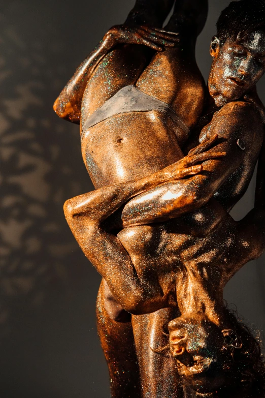 a statue of a man holding a woman, a bronze sculpture, inspired by Michelangelo Unterberger, mannerism, made of tar, gnarly details soft light, reflections in copper, muscular men entwined together