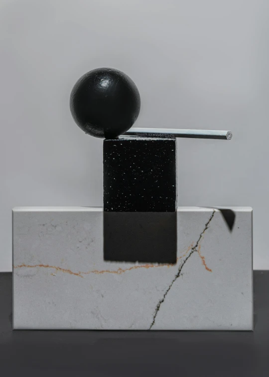a black ball sitting on top of a marble block, an abstract sculpture, enamel, 1 figure only, tall, pestle