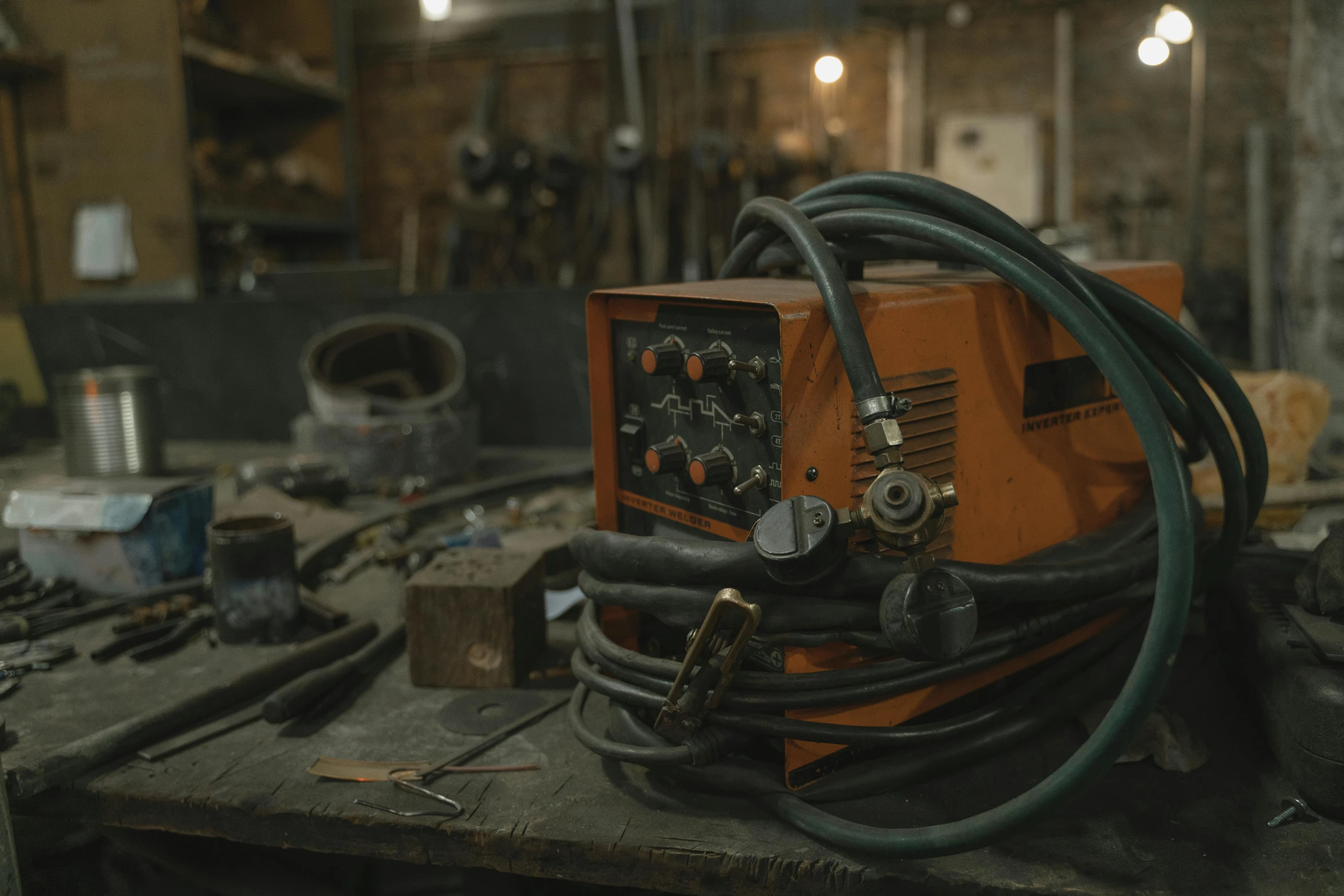 a welding machine sitting on top of a table, pexels contest winner, 4 k cinematic still, orange electricity, 🦩🪐🐞👩🏻🦳, ready to model