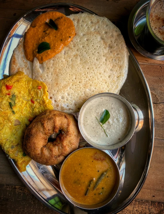 a plate of food sitting on top of a wooden table, dau-al-set, provocative indian, multiple stories, thumbnail, breakfast