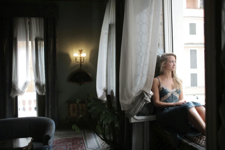 a woman sitting on a window sill looking out a window, inspired by Marià Fortuny, renaissance, photo of margot robbie, in a dark dusty parlor, venice, imgur