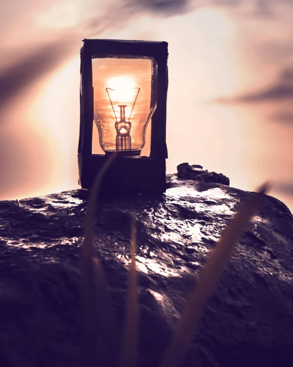 a light bulb sitting on top of a rock, pexels contest winner, romanticism, light box, lantern, profile picture, overlooking