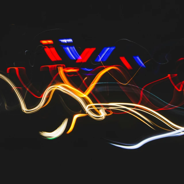 a blurry photo of a neon sign in the dark, pexels contest winner, lyrical abstraction, car moving fast, red and blue black light, colorful wires, abstract shapes