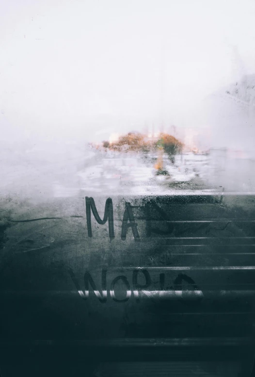 a fire hydrant sitting on the side of a road, by Adam Marczyński, pexels contest winner, magical realism, window ( rain ), abstract album cover, moist foggy, overlaid with cyrillic words