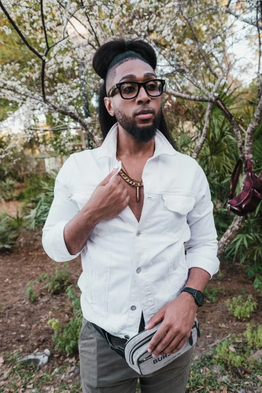 a man wearing glasses and a white shirt, an album cover, by Washington Allston, trending on pexels, renaissance, lush surroundings, man is with black skin, androgynous male, al fresco