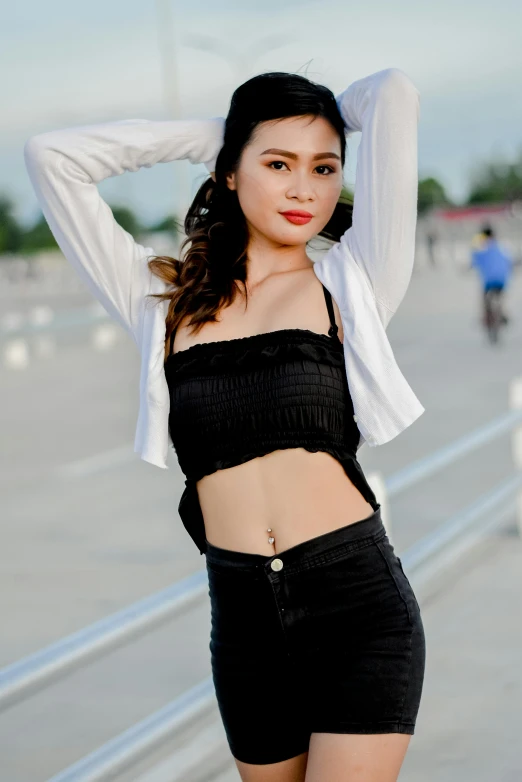 a woman in black shorts and a white shirt, by Max Buri, pexels contest winner, wearing a cropped tops, dao trong le, wearing black camisole outfit, square