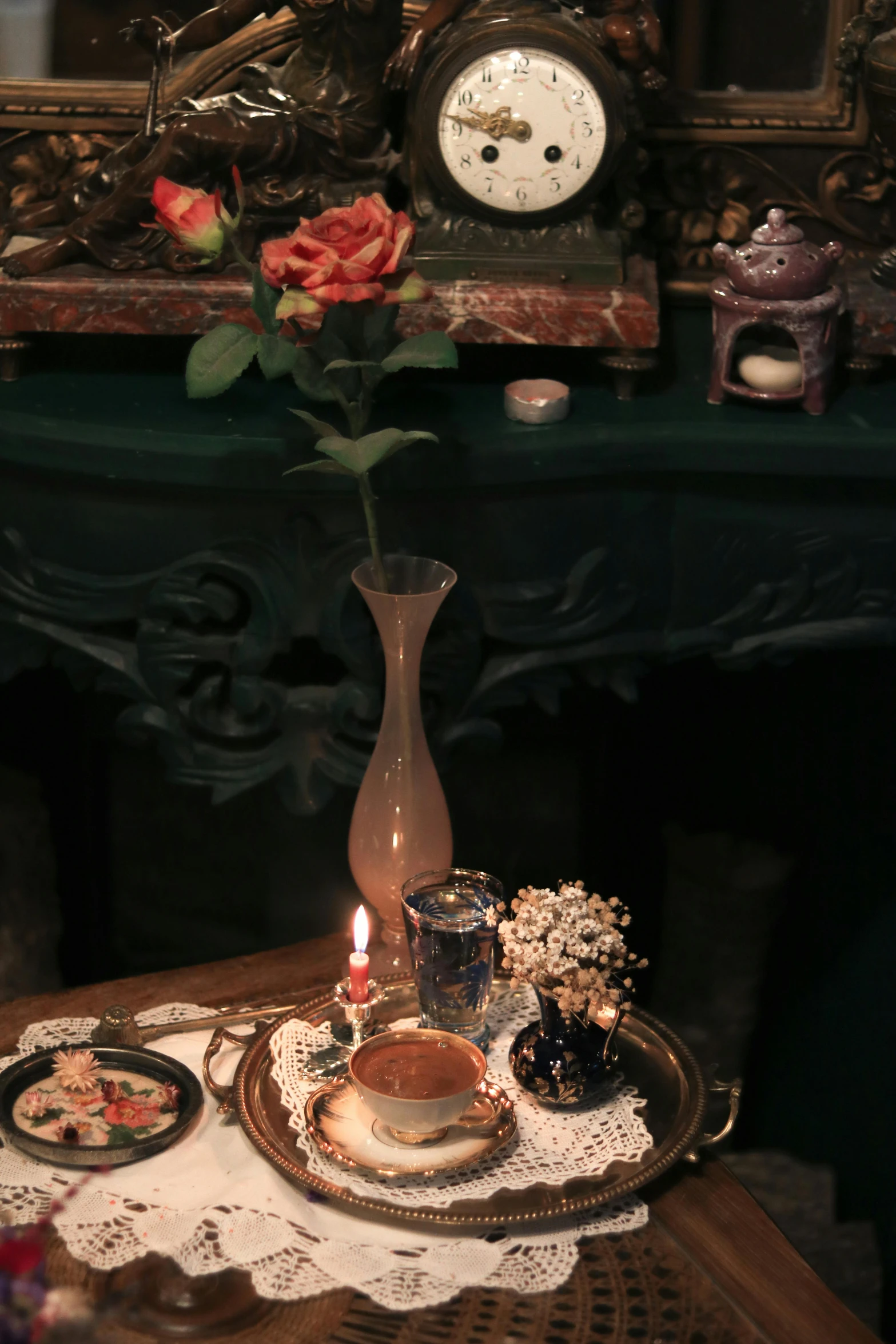 a table topped with a vase filled with flowers, vanitas, photo of a victorian dollhouse, occult aesthetics alchemy, nighttime!, medium close-up shot