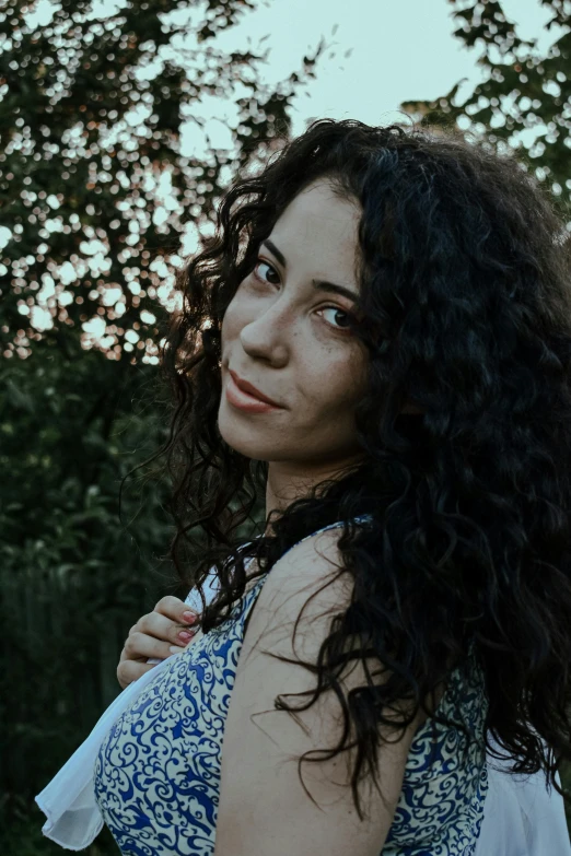 a woman in a blue and white dress holding a frisbee, pexels contest winner, renaissance, curly dark hair, ((portrait)), eytan zana, lovingly looking at camera