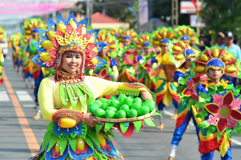 a woman in a colorful costume holding a basket of fruit, by Bernardino Mei, pexels contest winner, dau-al-set, dancers, wearing a neon green dress, leni robredo, square