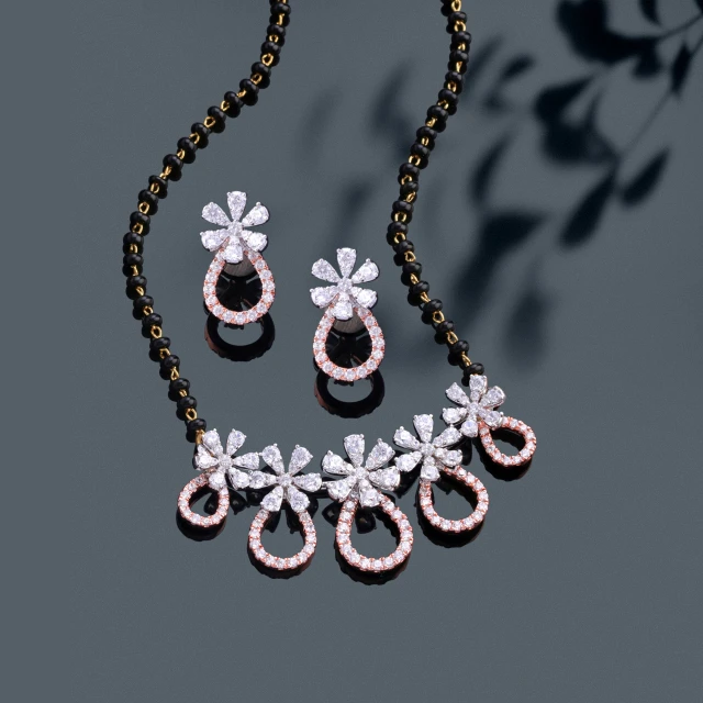 a necklace and earring set, a digital rendering, black white pink, shot with sony alpha 1 camera, blossoming rhythm, brown and pink color scheme