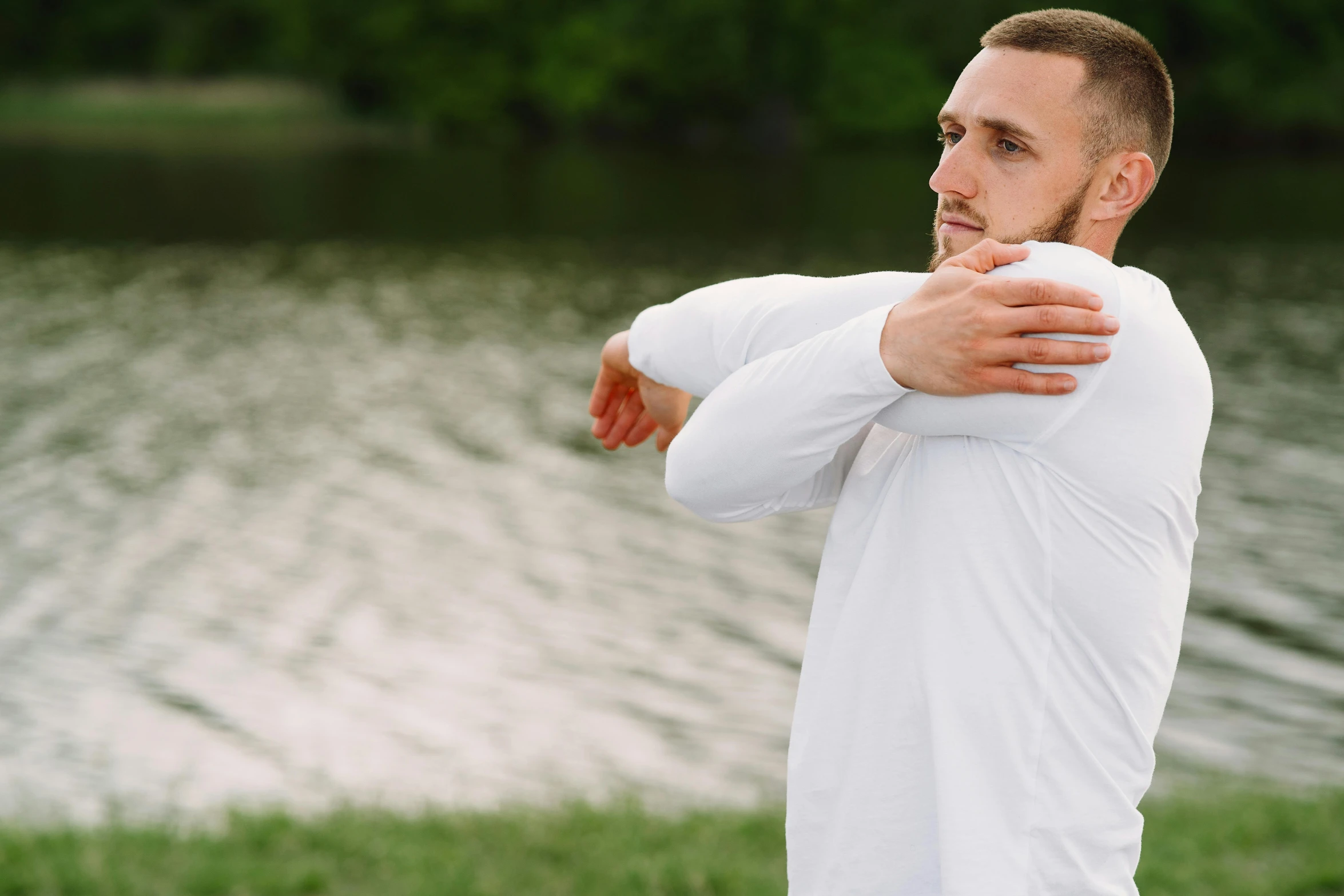 a man in a white shirt is throwing a frisbee, pexels contest winner, renaissance, hunched shoulders, cottagecore!! fitness body, sydney park, pixeled stretching