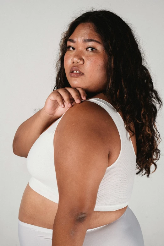 a woman in white underwear posing for a picture, wearing a cropped tops, overweight, looking off into the distance, detailed product image
