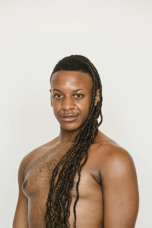 a man with dreadlocks posing for a picture, of a shirtless, on clear background, transgender, riyahd cassiem