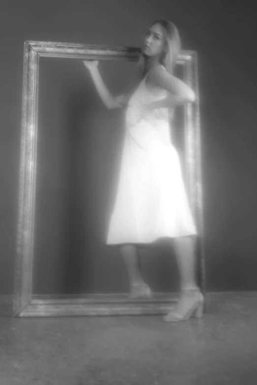 a woman in a white dress standing in front of a mirror, inspired by Lillian Bassman, conceptual art, t - pose, low quality photograph, image, [ floating ]!!