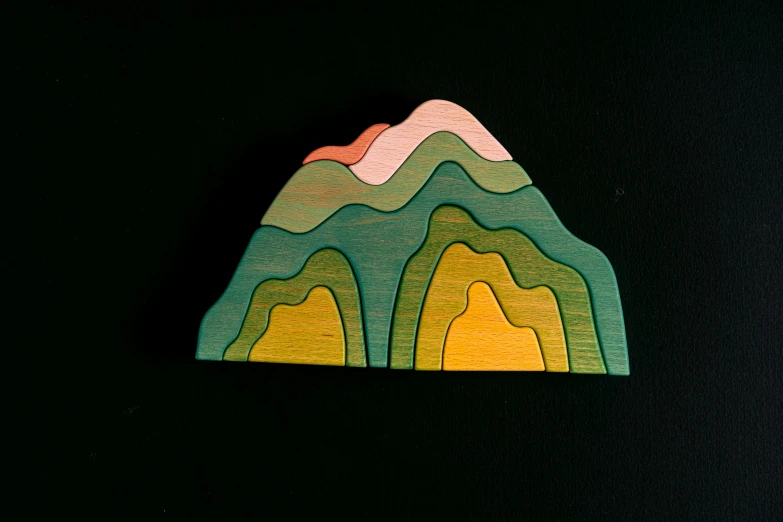 a piece of wood sitting on top of a black surface, mythical floral hills, childrens toy, elevation view, mountainside