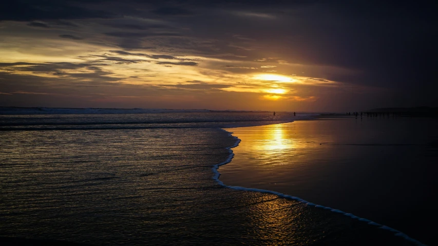 the sun is setting over the water on the beach, by Jan Tengnagel, pexels contest winner, fan favorite, liquid gold, goodnight, long view