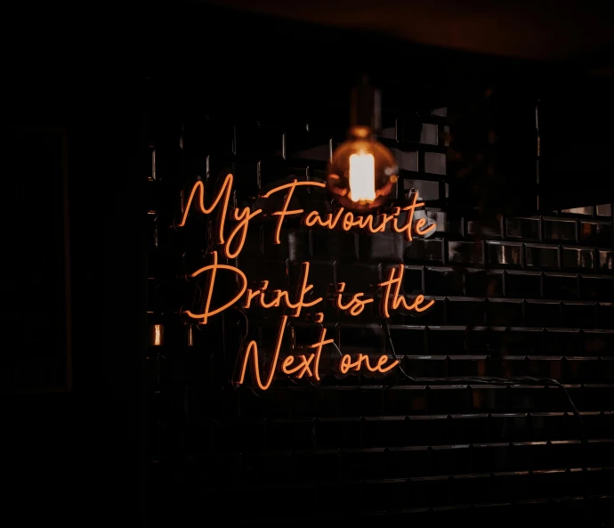 a neon sign that says my favorite drink is the next one, by Niko Henrichon, pexels contest winner, profile picture 1024px, teaser, single light, rex orange county