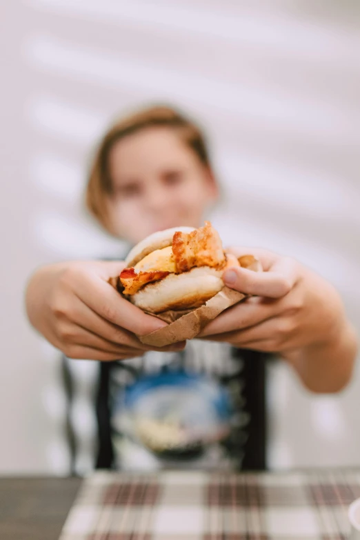 a close up of a person holding a sandwich, unsplash, visual art, teenage girl, steamed buns, covered in ketchup, 15081959 21121991 01012000 4k